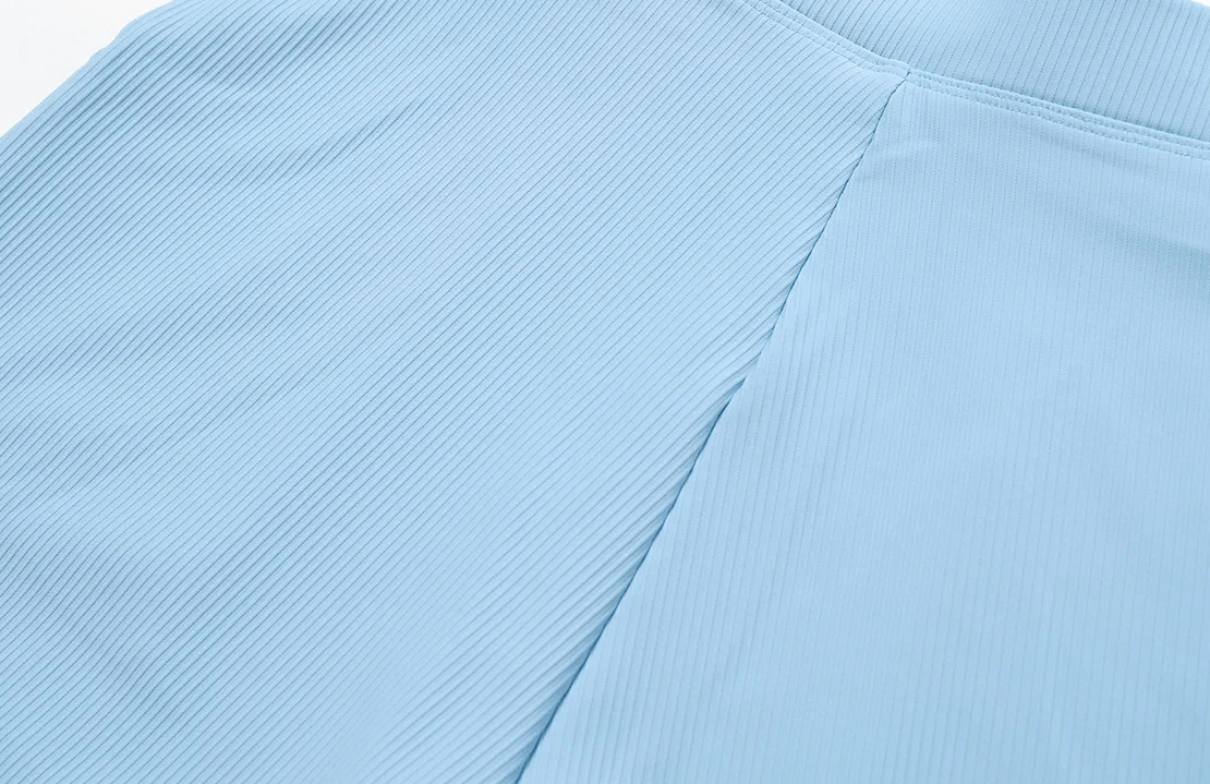 Close-up of blue ribbed fabric texture on workout shorts SF2204, ideal for women's fitness and yoga, featuring moisture-wicking nylon.